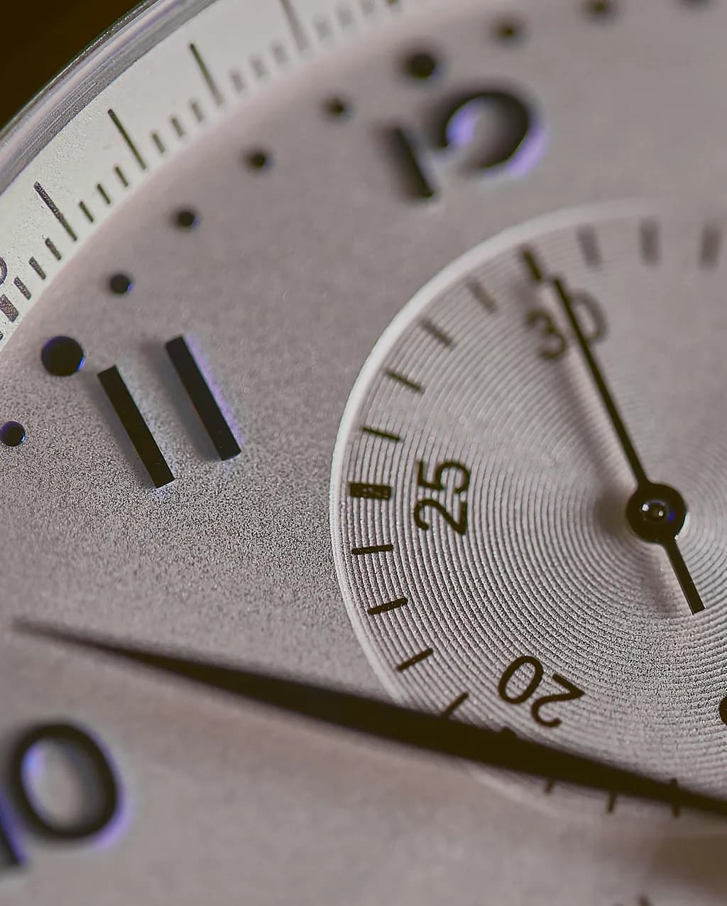 A close-up of a watch dial showing the minute track